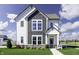 Charming two-story home with a modern farmhouse design and well-manicured lawn at 781 Rose Garden Way, Westfield, IN 46074