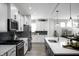 Bright kitchen featuring a center island, modern appliances, and ample cabinet space at 781 Rose Garden Way, Westfield, IN 46074