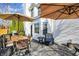 Back deck featuring outdoor seating, dining table, and umbrellas for shade and entertaining at 8107 Parcrest Ct, Indianapolis, IN 46259