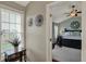 View into the primary bedroom that has a sitting area with a black accent table at 8107 Parcrest Ct, Indianapolis, IN 46259