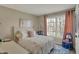 Bright bedroom with a plush rug, comfortable bed, and sunny window view at 8107 Parcrest Ct, Indianapolis, IN 46259