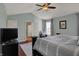 This primary bedroom has a ceiling fan, sitting area, and ensuite bathroom at 8107 Parcrest Ct, Indianapolis, IN 46259