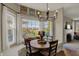 Cozy breakfast nook with bay window, built-in seating, and a charming round table at 8107 Parcrest Ct, Indianapolis, IN 46259