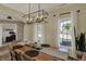 Bright dining room with natural light, a rustic wooden table, and views of the outdoors at 8107 Parcrest Ct, Indianapolis, IN 46259