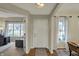 Welcoming foyer with hardwood floors, a stylish rug, and views into adjacent living spaces at 8107 Parcrest Ct, Indianapolis, IN 46259