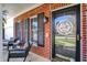 Cozy front porch with rocking chairs, decorative accents, and a view of the charming neighborhood at 8107 Parcrest Ct, Indianapolis, IN 46259