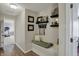 Inviting hallway features a cozy built-in bench with decor and awards shelf space at 8107 Parcrest Ct, Indianapolis, IN 46259