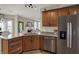 Open-concept kitchen with granite countertops, stainless steel appliances, and ample cabinet space at 8107 Parcrest Ct, Indianapolis, IN 46259