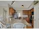 Spacious kitchen featuring granite countertops, wooden cabinets, and stainless steel appliances at 8107 Parcrest Ct, Indianapolis, IN 46259
