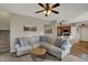 Open-concept living room with a comfortable sofa and view into the modern kitchen at 8107 Parcrest Ct, Indianapolis, IN 46259