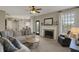 Spacious living room featuring a fireplace, comfortable seating, and neutral decor at 8107 Parcrest Ct, Indianapolis, IN 46259