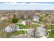 Aerial view showcasing the charming home with backyard pool in a lovely neighborhood at 8414 Anchorage Ct, Indianapolis, IN 46236