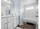 Bathroom with subway tile, modern vanity, and updated fixtures at 8414 Anchorage Ct, Indianapolis, IN 46236