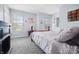 Comfortable bedroom with natural light from two windows and neutral decor at 8414 Anchorage Ct, Indianapolis, IN 46236