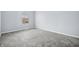 Simple carpeted bedroom with window and neutral wall color at 8414 Anchorage Ct, Indianapolis, IN 46236