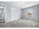 Bright bedroom featuring soft, neutral colors and a large window for natural light at 8414 Anchorage Ct, Indianapolis, IN 46236