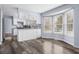 Bright eat-in kitchen area with large window and stainless refrigerator at 8414 Anchorage Ct, Indianapolis, IN 46236