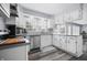 Bright kitchen with white cabinets, stainless steel appliances, and a large window at 8414 Anchorage Ct, Indianapolis, IN 46236