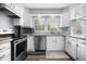 Beautiful kitchen with white cabinets, modern appliances, and ample counter space at 8414 Anchorage Ct, Indianapolis, IN 46236