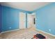 A versatile room showcases space for fitness and leads to additional rooms in the house at 8650 N Springview Dr, McCordsville, IN 46055