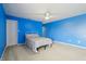 Blue bedroom showcasing a soothing color palette and comfortable sleeping arrangement at 8650 N Springview Dr, McCordsville, IN 46055
