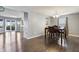 Inviting dining room with hardwood floors, chandelier, and easy access to kitchen and outdoor patio at 8650 N Springview Dr, McCordsville, IN 46055