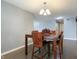 Dining area features a wooden table with seating and modern light fixture at 8650 N Springview Dr, McCordsville, IN 46055