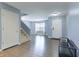 Welcoming foyer with a staircase and view into the well-lit living area at 8650 N Springview Dr, McCordsville, IN 46055