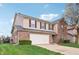Charming two-story home with a two-car garage, brick facade, and well-maintained lawn at 8650 N Springview Dr, McCordsville, IN 46055