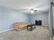 Cozy living room featuring a fireplace, comfortable seating, and neutral carpet at 8650 N Springview Dr, McCordsville, IN 46055