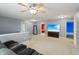 Bright loft with a ceiling fan, large TV, and views into other rooms at 8650 N Springview Dr, McCordsville, IN 46055