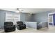 Comfortable loft area features two armchairs, a ceiling fan, and a view of the upstairs landing at 8650 N Springview Dr, McCordsville, IN 46055