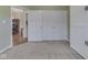 Bedroom with wall-to-wall closets and entrance to an adjacent living area at 871 Gazebo Way, Greenwood, IN 46142