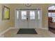 Inviting entryway with tiled floors, decorative glass doors, and neutral walls at 871 Gazebo Way, Greenwood, IN 46142