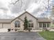 Attractive single-story home with stone facade, mature landscaping, and a driveway at 871 Gazebo Way, Greenwood, IN 46142