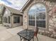 Charming stone exterior showcasing an outdoor patio area perfect for relaxing and entertaining guests at 871 Gazebo Way, Greenwood, IN 46142