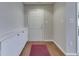 Bright entryway featuring wood floors, storage cabinets, and a welcoming front door at 871 Gazebo Way, Greenwood, IN 46142