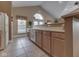 Clubhouse kitchenette area with modern appliances, abundant cabinet space, and a large window at 871 Gazebo Way, Greenwood, IN 46142