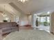 Open living room with wood floors, vaulted ceiling, and seamless access to other rooms at 871 Gazebo Way, Greenwood, IN 46142