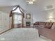 Spacious living room featuring vaulted ceilings, a fireplace, and large windows at 871 Gazebo Way, Greenwood, IN 46142