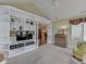Open living room with built-in shelving and an open view to the kitchen and dining area at 871 Gazebo Way, Greenwood, IN 46142
