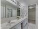 Bright main bathroom with double sinks, spacious mirrors, and walk-in closet access at 871 Gazebo Way, Greenwood, IN 46142