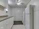 Hallway pantry features white shelving and cabinet storage at 871 Gazebo Way, Greenwood, IN 46142
