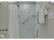 Modern shower with marble tile walls and glass shelves at 871 Gazebo Way, Greenwood, IN 46142