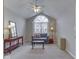 Bright sitting room with a large window, vaulted ceiling, and stylish decor at 871 Gazebo Way, Greenwood, IN 46142