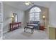 Comfortable sitting room featuring a large window, vaulted ceiling, and cozy seating area at 871 Gazebo Way, Greenwood, IN 46142