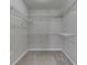 Empty walk-in closet features plenty of shelving space at 871 Gazebo Way, Greenwood, IN 46142