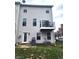 Backyard view featuring a balcony, grill, and green grass at 9454 Tanhurst Dr, Indianapolis, IN 46250
