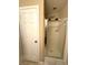 A full bath features a glass shower door, neutral paint colors, and updated fixtures at 9454 Tanhurst Dr, Indianapolis, IN 46250
