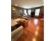 Spacious, hardwood floored bedroom features windows, TV, modern furnishings and unique decor at 9454 Tanhurst Dr, Indianapolis, IN 46250